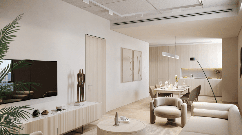Modern living room in neutral tones, featuring a dining area, large TV, comfortable seating, decorative sculptures and indoor plants in a Dubai villa, lit by natural and artificial light.