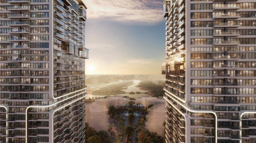 Vue depuis deux immeubles de grande hauteur surplombant une rivière pittoresque et un parc verdoyant au coucher du soleil, avec un ciel coloré et un paysage urbain à Dubaï.