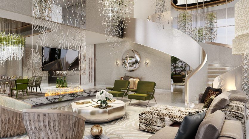 Un salon luxueux dans un appartement de Dubaï avec des lustres en cascade, un escalier en colimaçon et un mobilier raffiné dans une palette de couleurs neutres, mettant en valeur une esthétique de design élégante et moderne.
