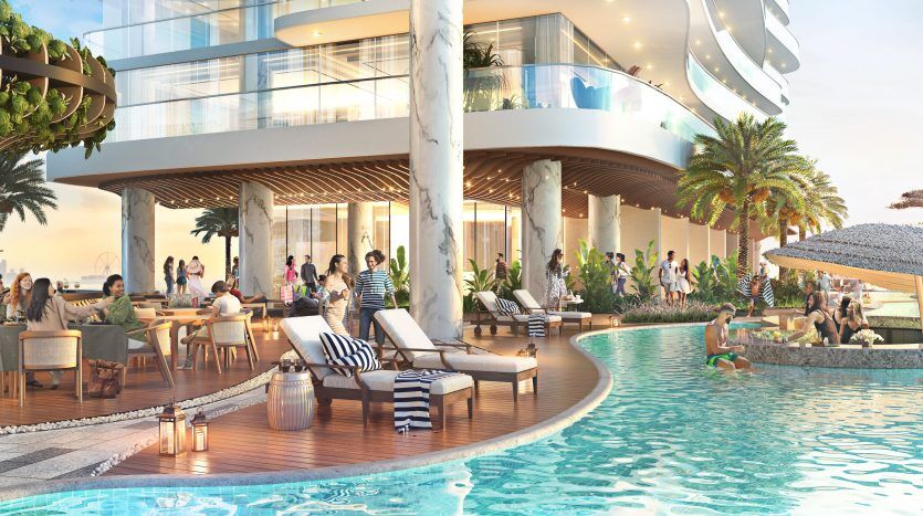 Luxueux complexe balnéaire de Dubaï où les gens se détendent et socialisent. Les caractéristiques comprennent une piscine, des coins salons extérieurs, des balcons vitrés et une vue panoramique sur l'océan.