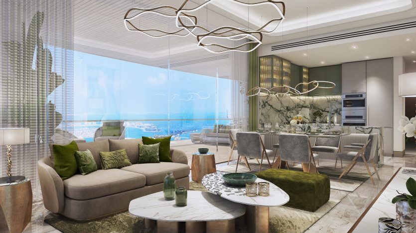 Luxueux salon décloisonné au décor moderne avec vue sur l'océan. Il comprend un coin salon avec des canapés moelleux, un espace salle à manger élégant et des luminaires suspendus élégants, parfaits pour un investissement à Dubaï.