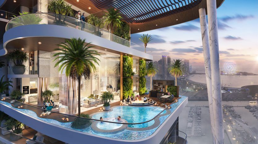 Une luxueuse terrasse à plusieurs niveaux dotée d'une piscine à débordement, de palmiers luxuriants et d'un mobilier d'extérieur élégant, avec une vue panoramique sur le paysage côtier de Dubaï au coucher du soleil.