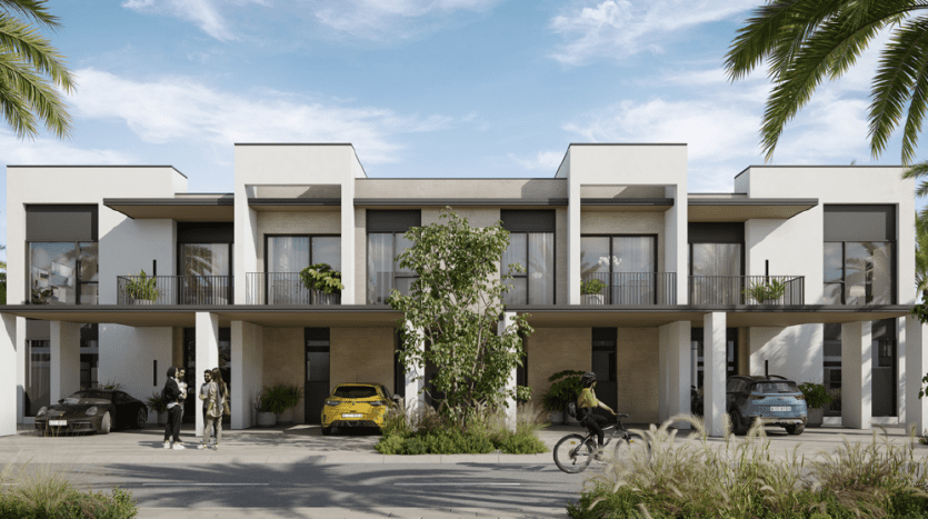 Maisons de ville modernes à deux étages avec balcons à Dubaï, présentant des lignes architecturales épurées et plusieurs voitures garées. Les gens discutent et font du vélo devant, au milieu d'une verdure luxuriante et de palmiers sous un ciel dégagé.