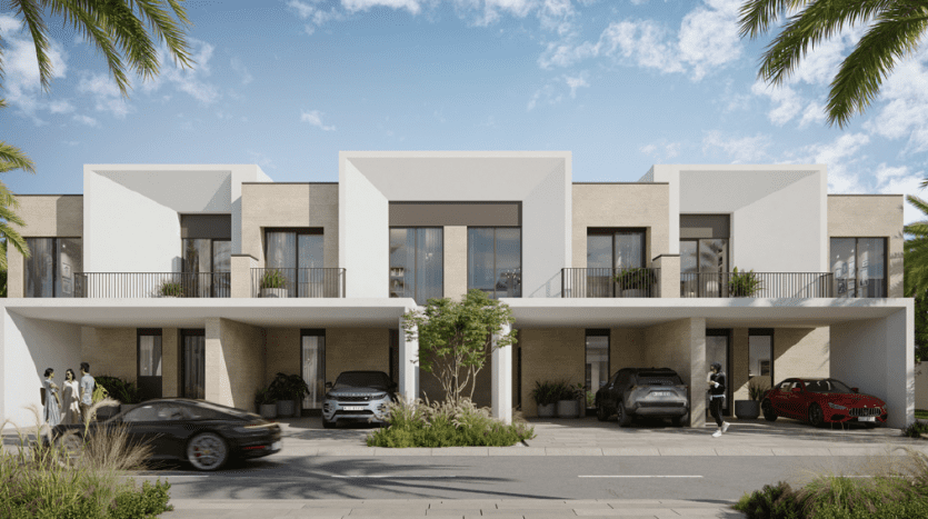 Immeuble d'appartements moderne à Dubaï avec des lignes épurées et géométriques, avec des façades beige clair et de grandes fenêtres. Les voitures sont garées devant et les gens marchent dans la rue bordée d’arbres.