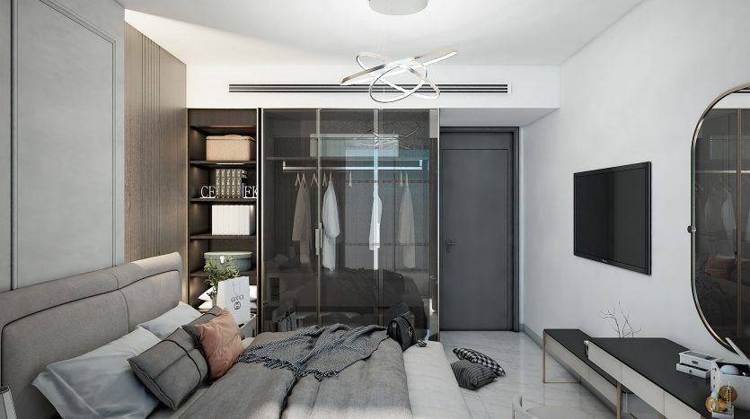 Chambre de villa moderne à Dubaï comprenant un grand lit avec une literie grise, des portes d'armoire en verre transparent, des meubles élégants, un plafonnier unique et une décoration minimaliste dans une palette de couleurs monochromes.