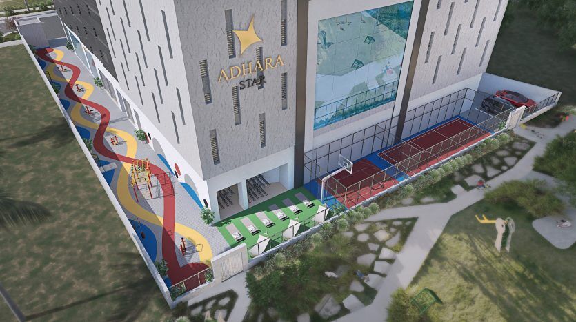 Vue aérienne d'un complexe sportif moderne avec un mur d'escalade coloré, des terrains de basket-ball et des courts de tennis, situé entre de grands bâtiments à Dubaï.