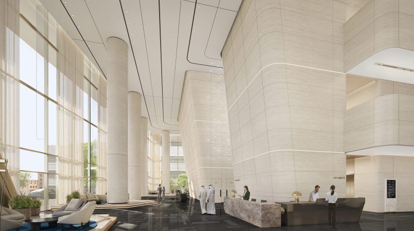 Lobby d'hôtel moderne avec une architecture incurvée élégante, de grandes fenêtres, un décor minimaliste et plusieurs personnes interagissant près de la réception, idéal pour investir à Dubaï.