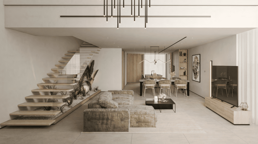 Modern living room in a Dubai real estate property incorporating natural elements with a floating staircase, several green plants and light, neutral tones; spacious yet warm atmosphere underlined by elegant furniture and lighting.