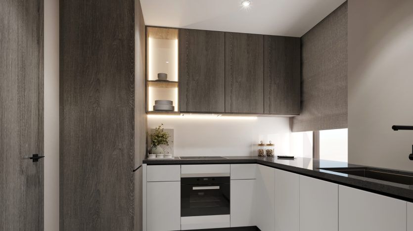 Cuisine moderne dans une villa de Dubaï avec des armoires élégantes en bois sombre, des appareils électroménagers intégrés et un éclairage sous les armoires, mettant en valeur une palette de couleurs minimaliste en noir et blanc.