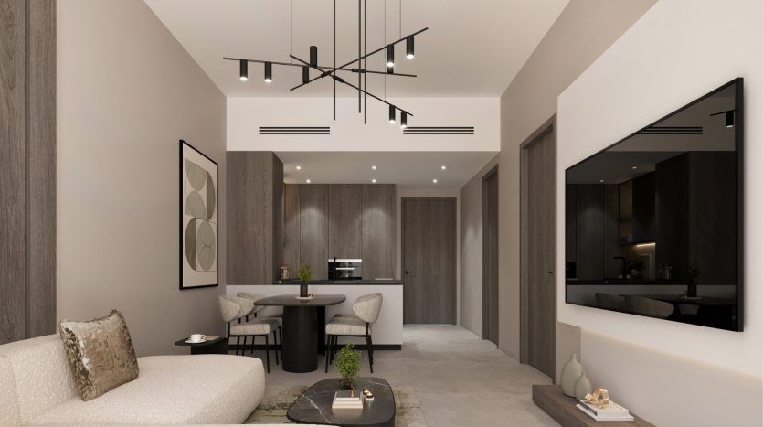 Intérieur d'appartement moderne à Dubaï comprenant une cuisine élégante avec des armoires sombres, un salon confortable avec un mobilier neutre, des œuvres d'art abstraites et un luminaire élégant.