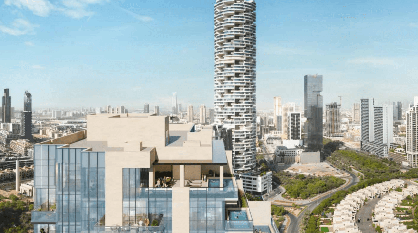 Vue aérienne d'un paysage urbain moderne avec une tour en spirale distinctive, de nombreux gratte-ciel et des zones résidentielles soigneusement aménagées sous un ciel clair à Dubaï.