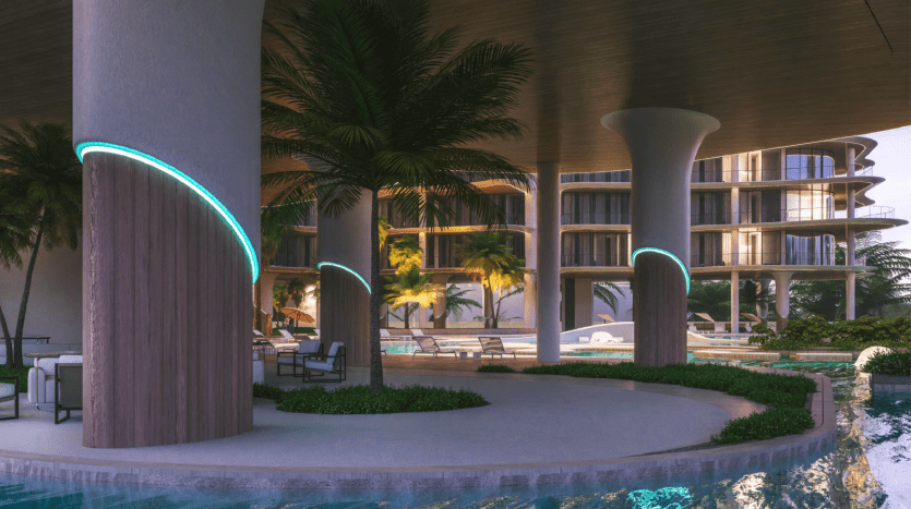 Un espace piscine intérieur luxueux avec des courbes et des colonnes éclairées au néon, entouré de palmiers et de coins salons luxueux sous une structure architecturale moderne, proposé par une agence immobilière de premier plan à Dubaï.