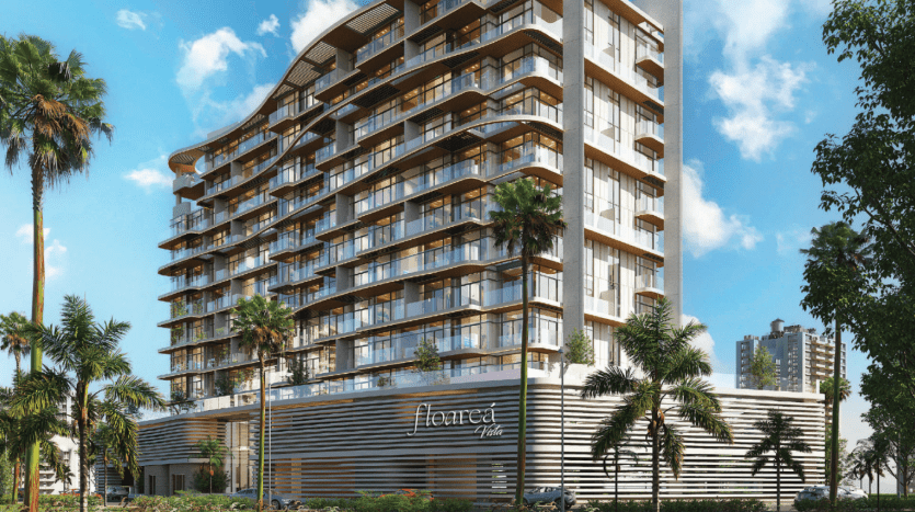 Immeuble résidentiel moderne de grande hauteur avec balcons entourés de palmiers par une journée ensoleillée à Dubaï, nommé « Floreca », reflétant un environnement de vie luxueux.