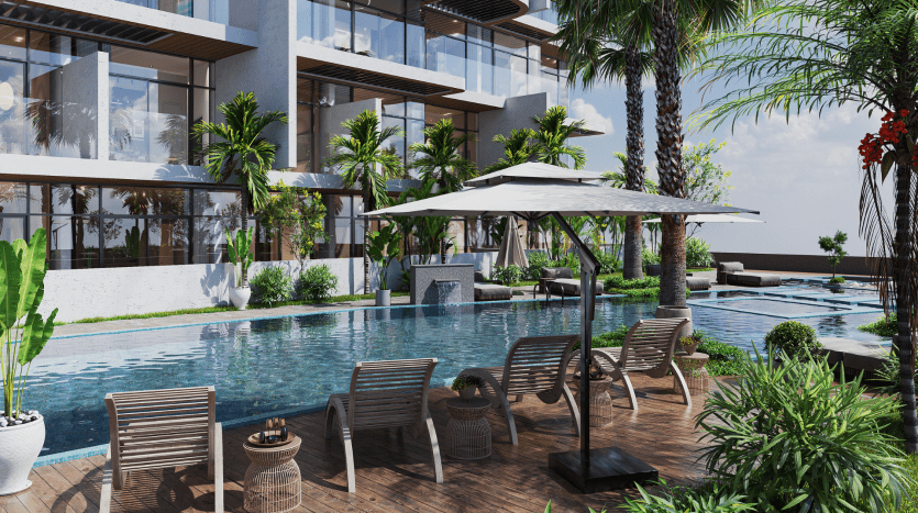 Un espace piscine luxueux d'hôtel avec chaises longues et parasols, entouré de plantes tropicales luxuriantes et adjacent à un bâtiment moderne doté de grandes fenêtres en verre, géré par une agence immobilière de premier plan à Dubaï.