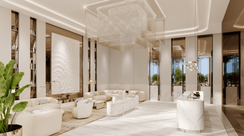 The Pier's luxurious lobby features modern décor with marble floors, large windows and plush beige seating. A reception desk with hanging lights and abstract ceiling sculpture enhances the sophisticated ambience, while lush green plants add a touch of nature.