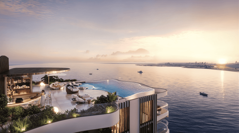 A luxurious rooftop terrace overlooking a vast ocean, complete with infinity pool, lounge area with sofas and tables, and lush greenery. The sun sets, casting a warm golden glow over the water. Boats can be seen in the distance, adding a touch of charm reminiscent of The Pier.
