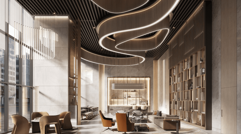 Un hall d'entrée moderne et haut de gamme sur Parkway dispose de hauts plafonds avec des luminaires en spirale, d'un mur d'étagères et d'élégants coins salon avec tables et chaises. De grandes fenêtres invitent la lumière naturelle à illuminer magnifiquement l'espace.