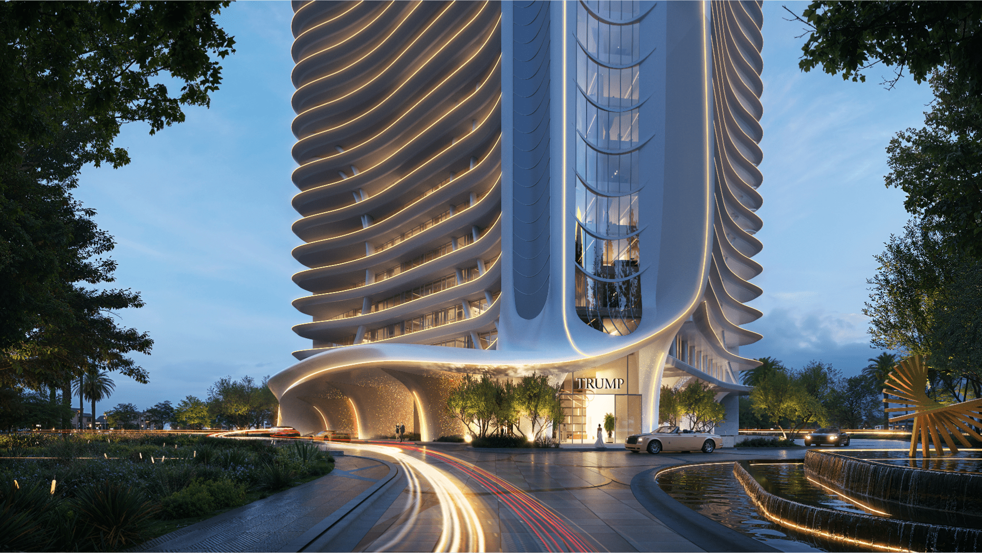 Un grattacielo moderno e futuristico, simile alla Trump Tower, presenta un'architettura bianca e curva illuminata da luci al tramonto. Auto con fari sfocati passano davanti all'edificio, che è circondato da un paesaggio verde e da uno specchio d'acqua.