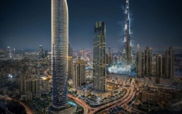 Paysage urbain nocturne de Dubaï, avec de grands gratte-ciel illuminés, dont le Burj Khalifa et le Binghatti Skyblade, entourés de lumières urbaines, de routes fréquentées et de bâtiments urbains.