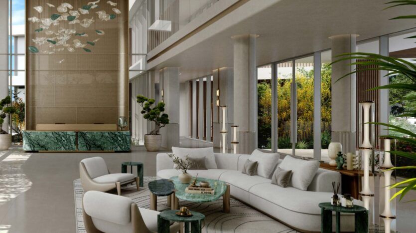 Modern, spacious Palm Central hotel lobby with high ceilings, large windows, curved white sofa, green marble tables, indoor plants and decorative chandelier. Natural light illuminates this elegant space with its contemporary decor.