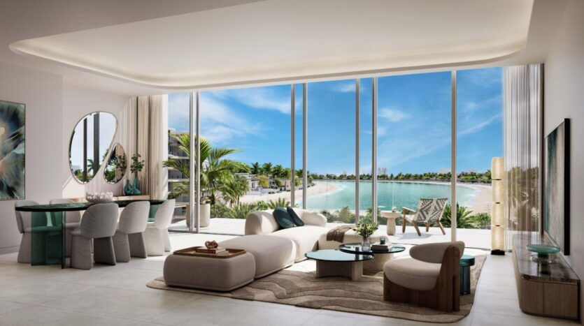 Palm Central's modern, airy living and dining rooms feature curved furniture, elegant decor and floor-to-ceiling windows overlooking palm trees, the sandy beach, turquoise water and bright blue skies.
