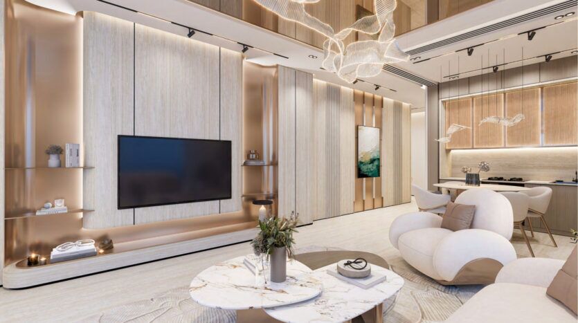 Salon moderne aux tons neutres, doté d'une grande télévision murale, d'une table basse en marbre, de fauteuils blancs moelleux et d'un éclairage décoratif, inspiré par le design élégant du Breez by Danube Maritime City. La cuisine ouverte est dotée d'armoires élégantes et d'un coin repas.