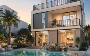 Maison moderne de deux étages à The Heights, avec de grandes baies vitrées, un balcon et des sièges extérieurs au bord d'une piscine. Des palmiers et de la verdure luxuriante entourent la zone tandis que les gens se détendent au bord de la piscine au coucher du soleil.