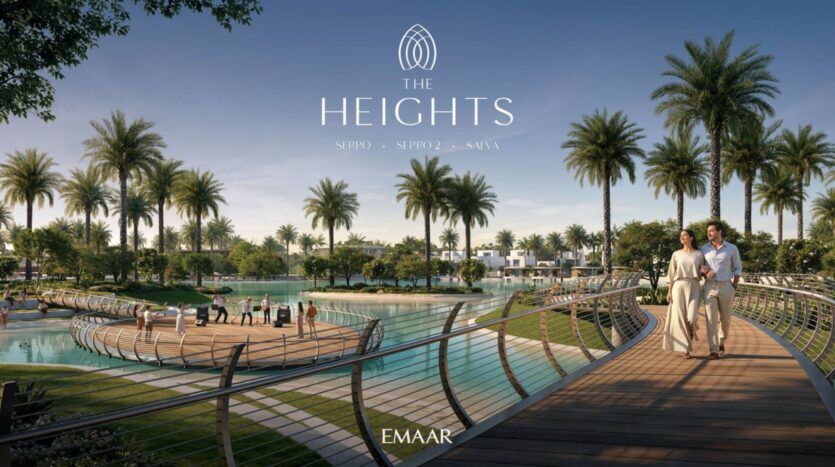 Un couple marche sur un pont en bois incurvé au-dessus d'un étang entouré de palmiers, de pelouses manucurées et de villas modernes sous un ciel bleu clair. Le texte indique "The Heights" - un style de vie serein offert par EMAAR.