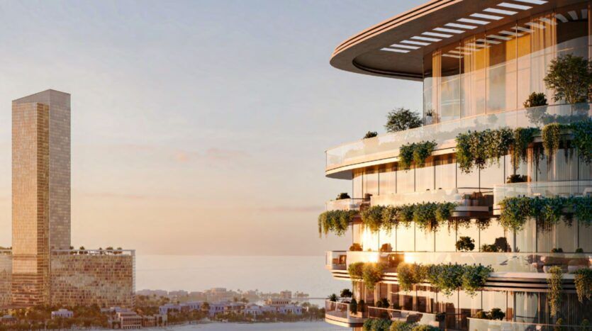 A modern circular building with glass balconies covered in greenery stands in the foreground at sunset, resembling a castle overlooking an urban landscape with a tall rectangular skyscraper and water in the background.