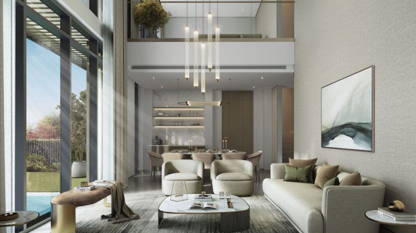 A modern, spacious living room at The Orchard by Sobha, featuring high ceilings, large windows, neutral-toned furnishings, abstract artwork, and views of the garden and outdoor pool.