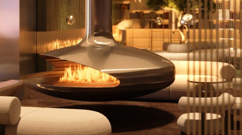 A modern living room in the Wow Tower featuring a suspended metal fireplace with a glowing fire. Surrounded by contemporary cream-colored sofas and warm lighting, the space is comfortable and inviting.
