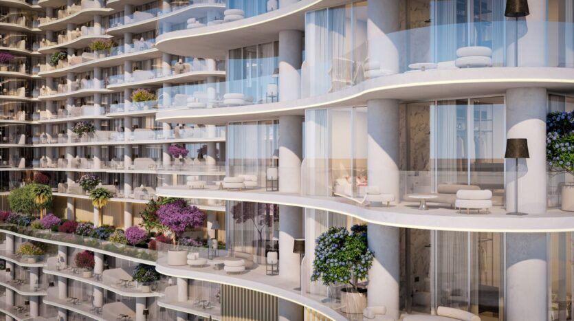The Wow Tower is defined by its modern, curved balconies, featuring glass railings and outdoor seating. Each balcony is adorned with potted plants and flowers, and large windows and sliding glass doors open onto elegant interiors.