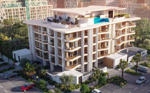 Calisi by Zoya est un immeuble moderne de plusieurs étages avec de grands balcons, une piscine sur le toit et un aménagement paysager luxuriant. Des voitures sont garées autour de l'immeuble, tandis que les gratte-ciel voisins sont visibles à l'arrière-plan.