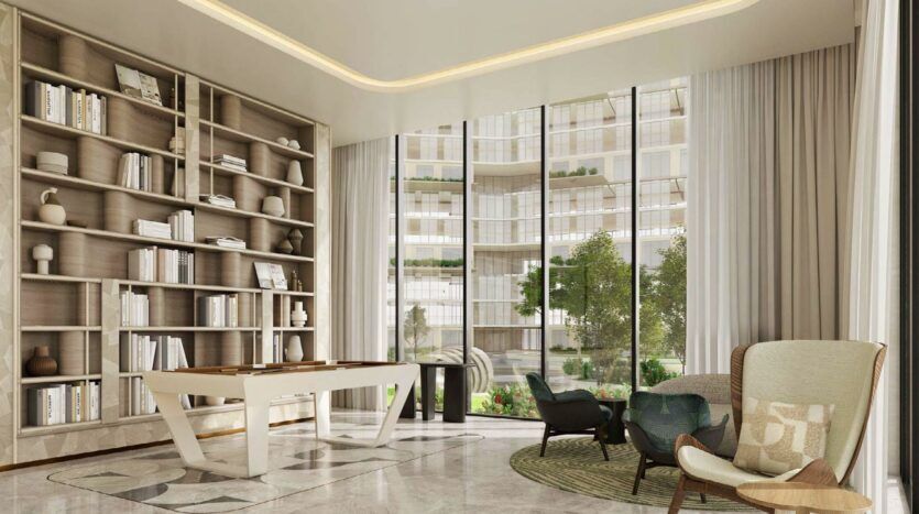 Salon moderne avec des fenêtres allant du sol au plafond, une grande bibliothèque remplie de livres et de décorations, une table blanche élégante, des fauteuils, un tapis rond, et une vue imprenable sur le jardin et l'immeuble contemporain Arancia Yards by Beyond à l'extérieur.