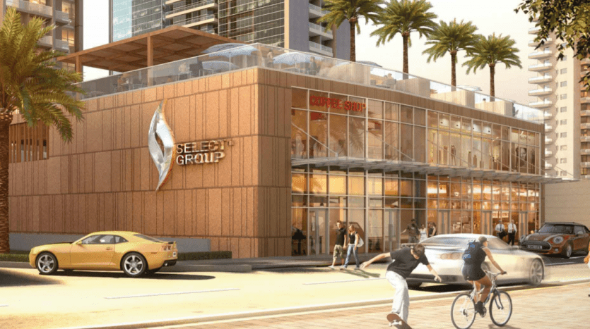 Représentation artistique d'un café urbain moderne à Dubaï avec de grandes fenêtres en verre et un extérieur en bois. Les gens marchent et font du vélo dans une rue ensoleillée bordée de grands immeubles et les voitures sont garées à proximité.