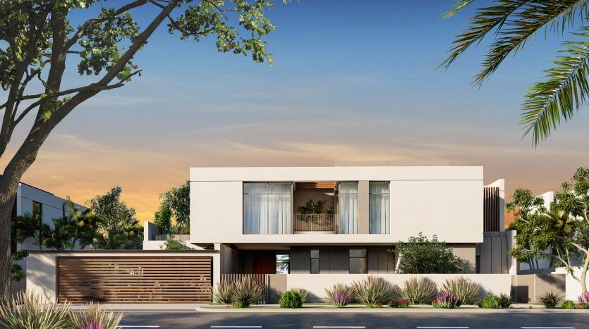 Maison moderne à deux étages avec un toit plat, de grandes fenêtres et un portail en bois, entourée de plantes tropicales et de palmiers à Al Furjan sous un ciel bleu clair.