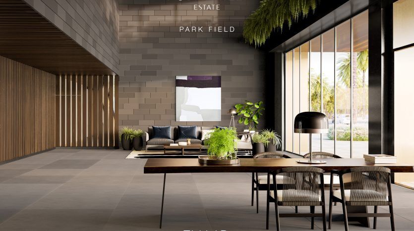 Un luxueux salon moderne dans une villa Dubai Hills Estate avec un canapé, des chaises, de grandes fenêtres offrant une vue sur la verdure et une décoration de bon goût comprenant des plantes et des œuvres d'art.