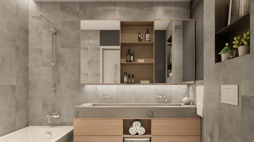 Salle de bain moderne aux tons neutres comprenant une baignoire, un espace douche séparé, un grand miroir, une vasque en bois avec vasque et des plantes en pot, répertoriée par une agence immobilière Dubaï à Dubai Hills Estate,