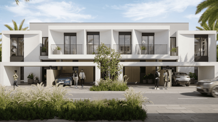 Modern two-storey residential townhouses with flat roofs in Dubai, surrounded by lush landscaping. People, cars and a passing vehicle blur illustrate a dynamic, upscale neighborhood.