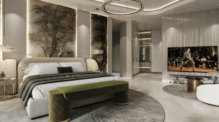 Chambre luxueuse dans une villa de Dubaï avec un lit queen-size moelleux, un élégant tapis circulaire et un mobilier moderne. La pièce présente des accents dorés, des œuvres d'art murales sur le thème tropical et un mur en miroir reflétant une télévision.
