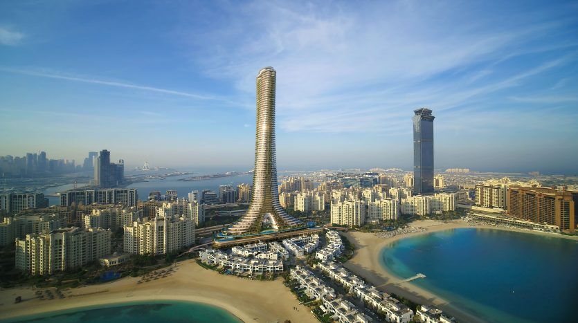Vue aérienne d'un gratte-ciel unique en forme de spirale dominant un paysage urbain côtier avec des bâtiments résidentiels et des plages sous un ciel bleu clair, représentant une excellente opportunité d'investissement à Dubaï.