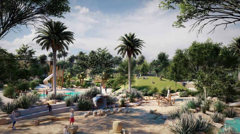 Un parc luxuriant avec des palmiers, un toboggan aquatique et une aire de jeux sablonneuse. L'environnement serein comprend un sentier pédestre et des bancs à l'ombre des arbres, parfaits pour ceux qui envisagent d'investir à Dubaï.