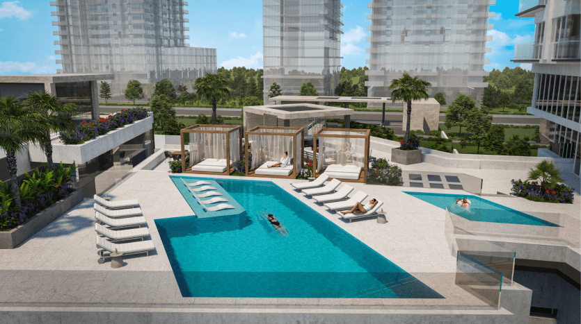 Une piscine extérieure de luxe située entre des immeubles modernes de grande hauteur à Dubaï, avec des cabanes, des transats, des plantations luxuriantes et des gens se relaxant au bord de l'eau.