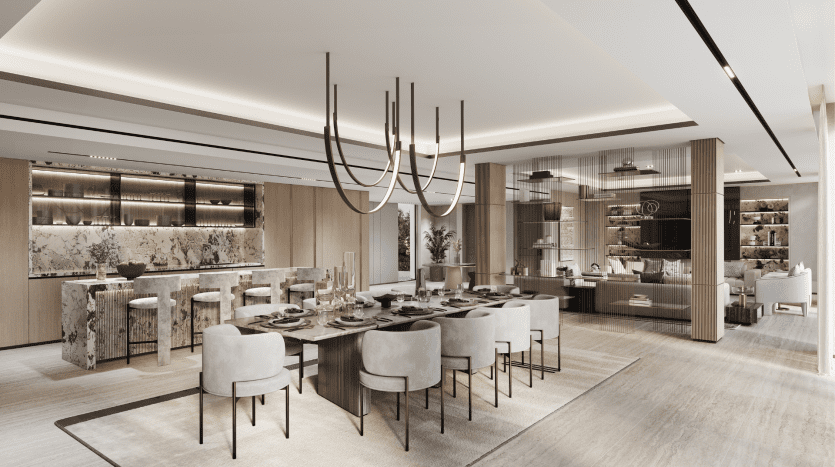 Cuisine et salle à manger modernes et luxueuses dans une villa de Dubaï avec des comptoirs en marbre, des lustres élégants et une grande table à manger dressée pour un repas. Les tons neutres et les éléments de design élégants soulignent un intérieur sophistiqué.