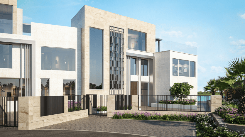 Maisons de luxe modernes dotées de grandes fenêtres, de façades en béton et en pierre, entourées d'un aménagement paysager luxuriant et d'un ciel bleu, parfaites pour investir à Dubaï.