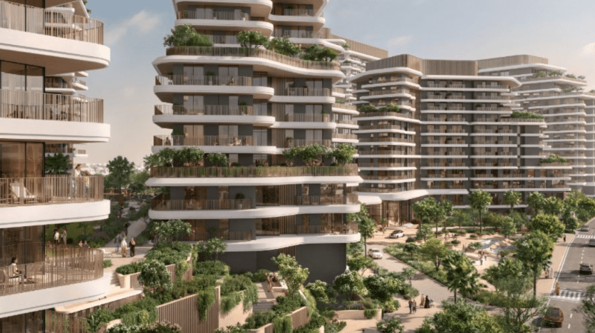 Un complexe résidentiel moderne comprenant plusieurs immeubles de grande hauteur dotés de balcons incurvés et superposés. La région est luxuriante de verdure, comprenant des arbres et des buissons Verdes. On peut voir des gens marcher et se détendre dans les espaces communs autour d’une piscine et de sentiers.