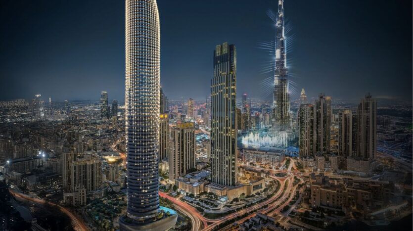 Paysage urbain nocturne de Dubaï, avec de grands gratte-ciel illuminés, dont le Burj Khalifa et le Binghatti Skyblade, entourés de lumières urbaines, de routes fréquentées et de bâtiments urbains.