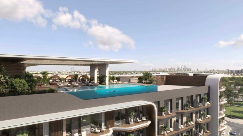 Une piscine à débordement sur le toit, agrémentée de transats et de cabines, au sommet d'un immeuble moderne, entourée de verdure, avec vue sur les toits de la ville sous un ciel bleu parsemé de nuages : découvrez le luxe à son apogée au Mirari Lagoon by Zoya.
