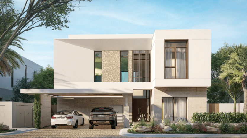 Villa moderne de deux étages à Dubaï avec un toit plat, dotée de grandes fenêtres, d'un balcon et d'un abri pour deux voitures. La façade comprend des accents de pierre, entourée d'un jardin paysager.