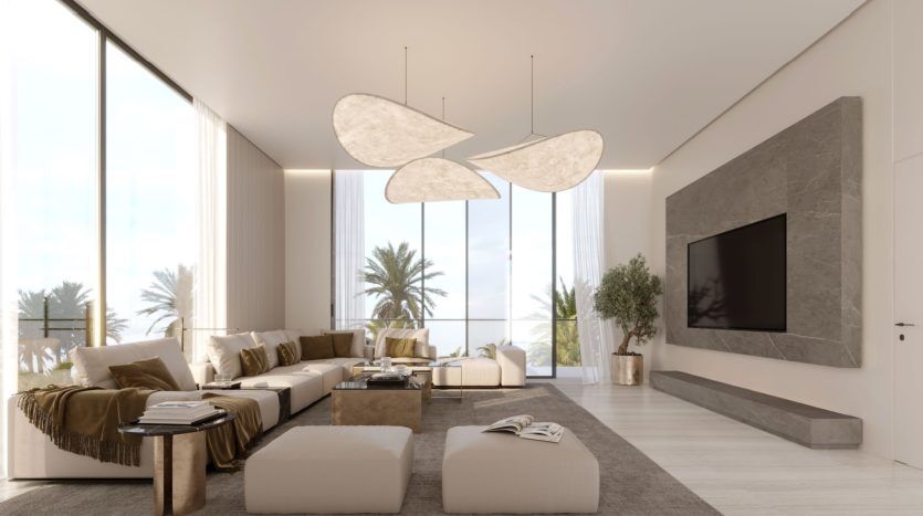 Un salon moderne et spacieux dans un appartement à Dubaï avec de grandes fenêtres montrant des palmiers à l'extérieur, des meubles de couleur claire, des plafonniers uniques et un élégant mur multimédia intégré.